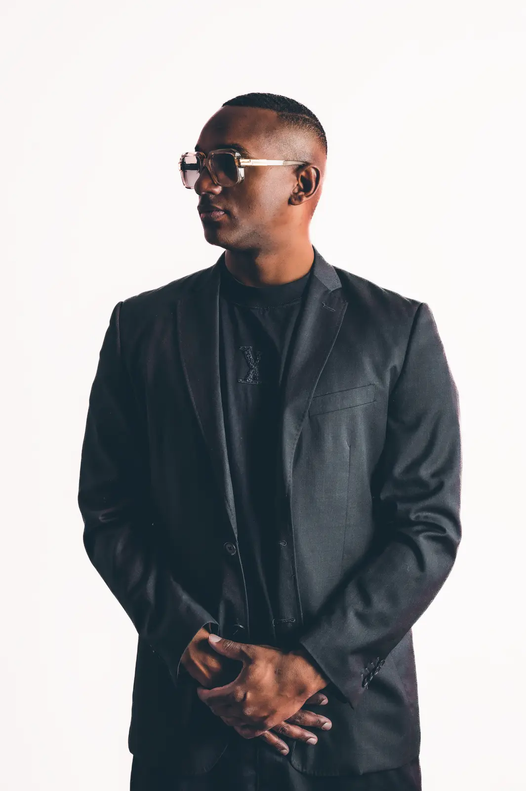 Hurrican X in a black jacket, studio portrait